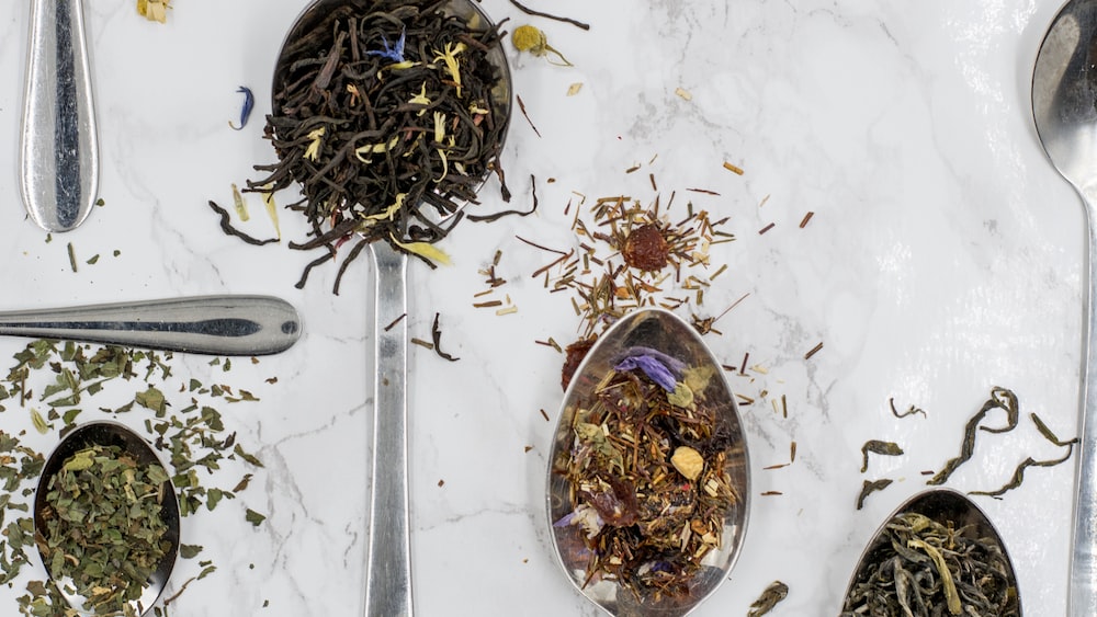 Aromatic tea selection with a gray stainless steel spoon