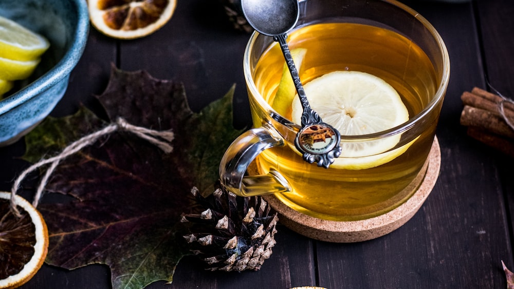 Autumn-inspired White Tea with Lemon in a Clear Glass Teacup