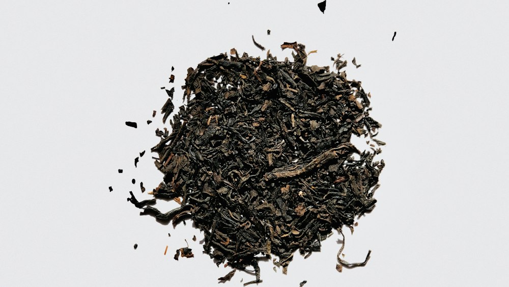 Brown Dried Tea Leaves on White Surface