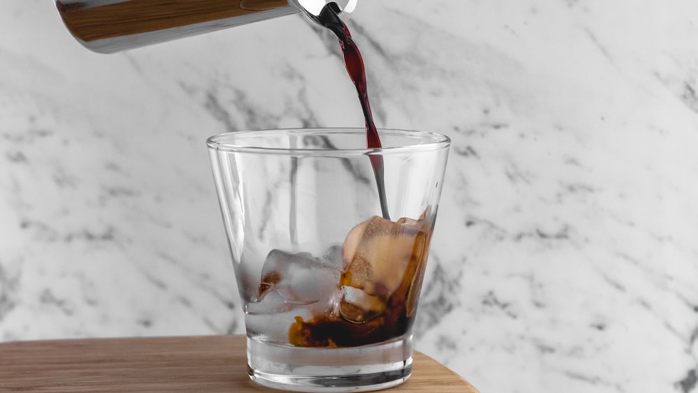 Caffeinated Cold Brew Coffee Pouring Over Ice