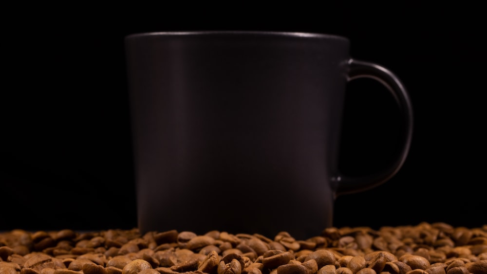 Caffeine Boost: Coffee Cup and Beans