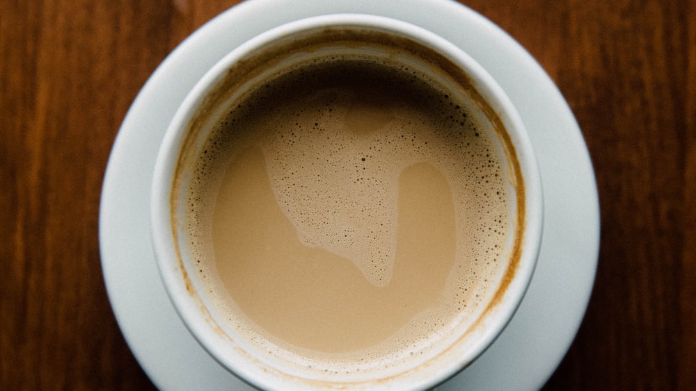 Caffeine-rich latte in a white ceramic mug