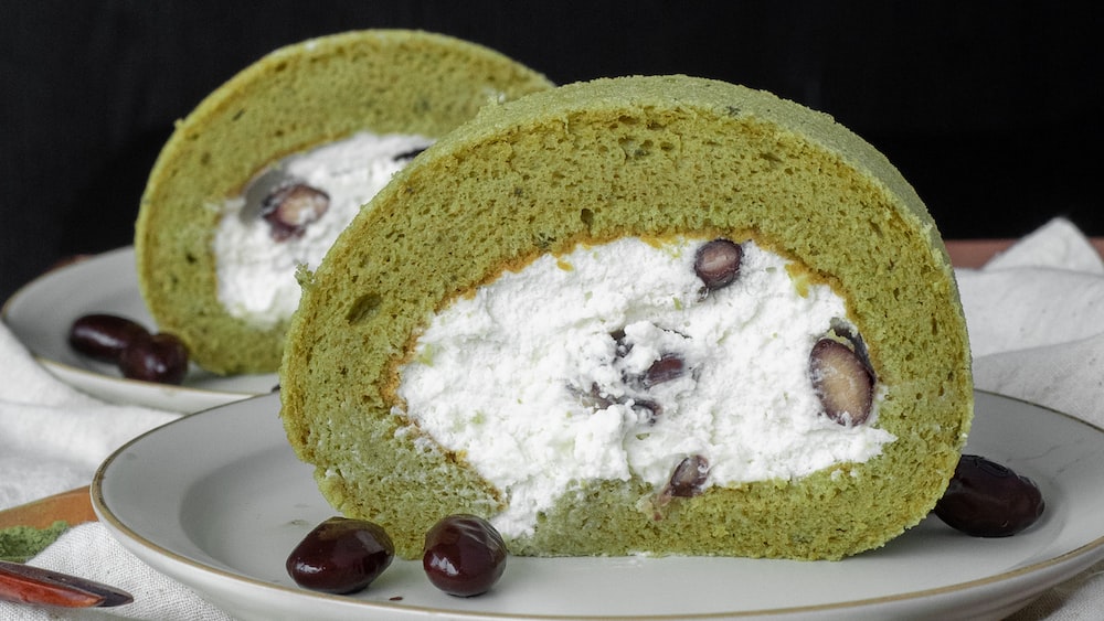 Delicious Matcha Swiss Roll on a Ceramic Plate