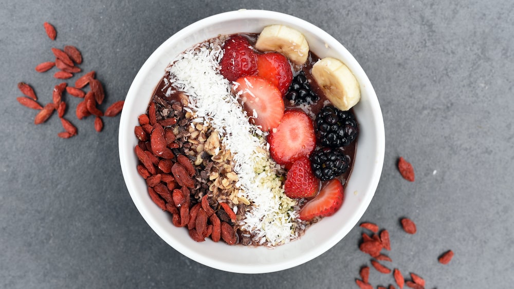 Health-Boosting Fusion: Refreshing Smoothie Bowl with Assorted Sliced Fruits