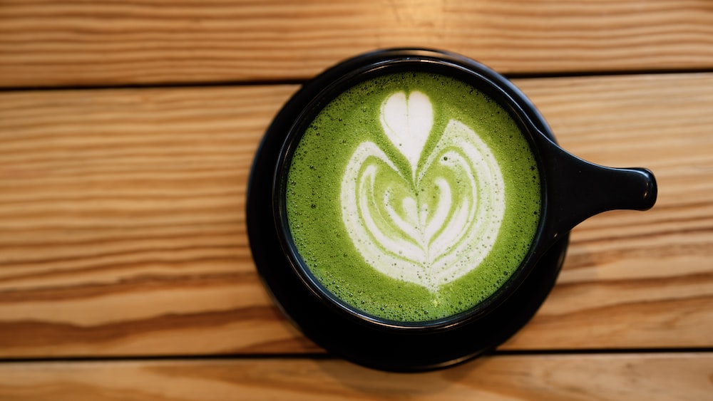 Matcha Love: A Latte on a Black Ceramic Mug