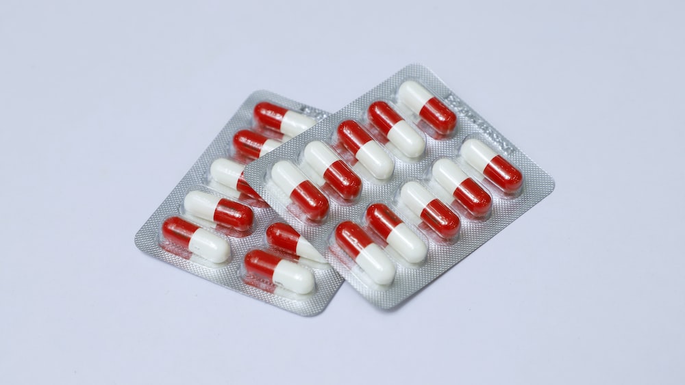Medication Blister Pack: Red and White Pills for Health & Wellness