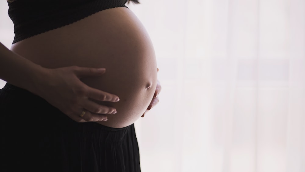 Pregnancy Expectations: Woman Embracing Maternal Health