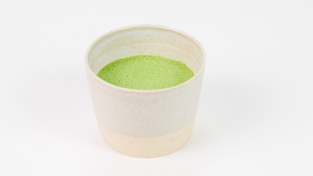 Refreshing Green Tea Latte in a Green and White Ceramic Cup