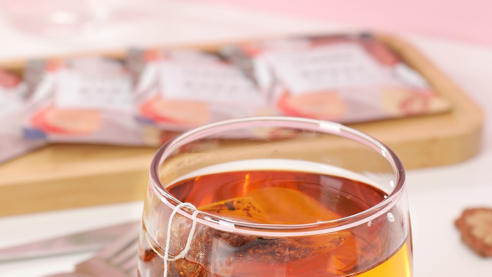 Refreshing Rooibos Peach Blend Tea in a Clear Drinking Glass