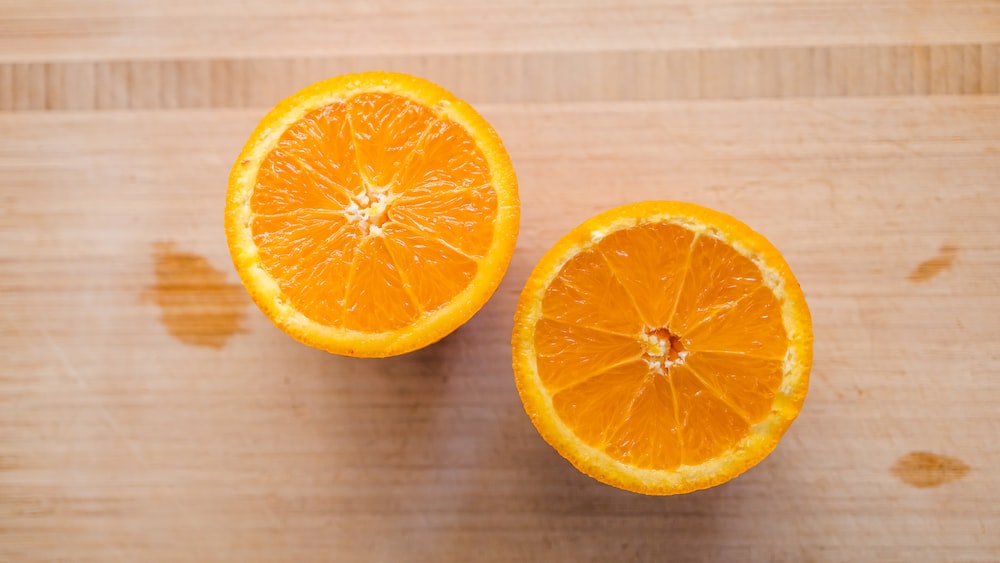 Refreshing Vitamin C Boost: Orange Slice on Wooden Board