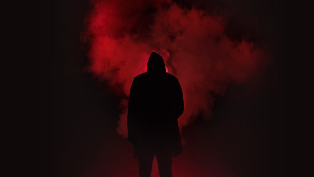 Side Effects Illustrated: Silhouette of a Person in a Dark Place with Smoke