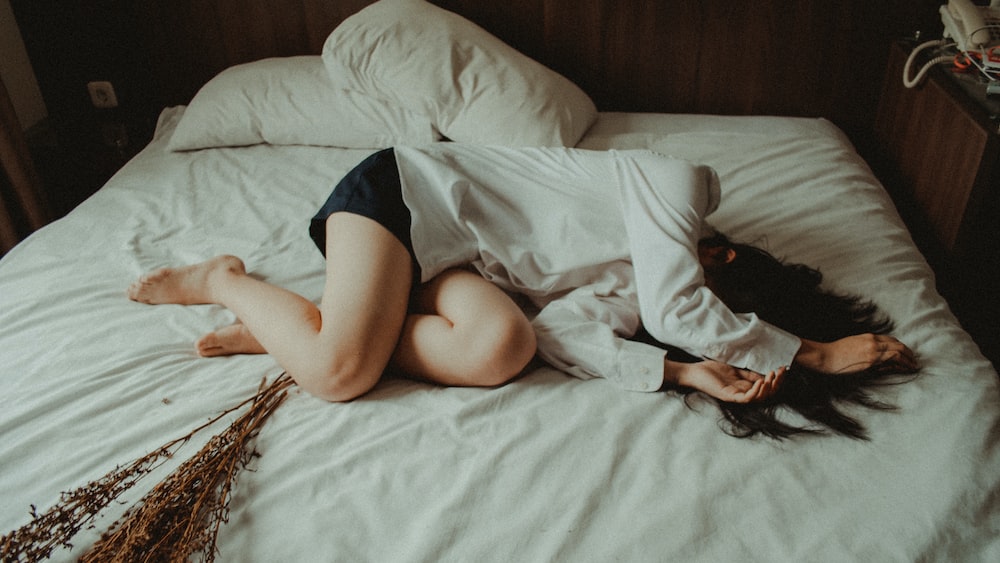 Sleep Disturbances: A Sleepy Woman Lying on Bed