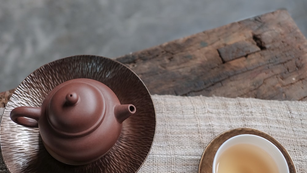 Soothing Tea Time with a Brown Kettle and White Cup