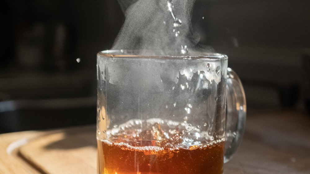 Steeping Kukicha Tea: Clear Glass with Brown Infusion