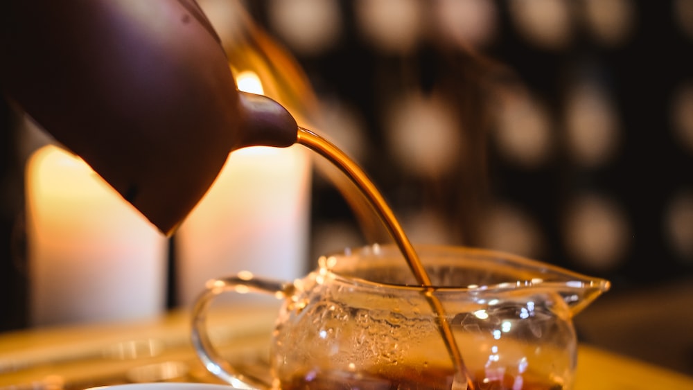 Tea Connoisseur Holding Brown Teacup
