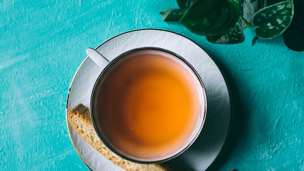 Tea Delight: Yellow Elixir in a Ceramic Teacup