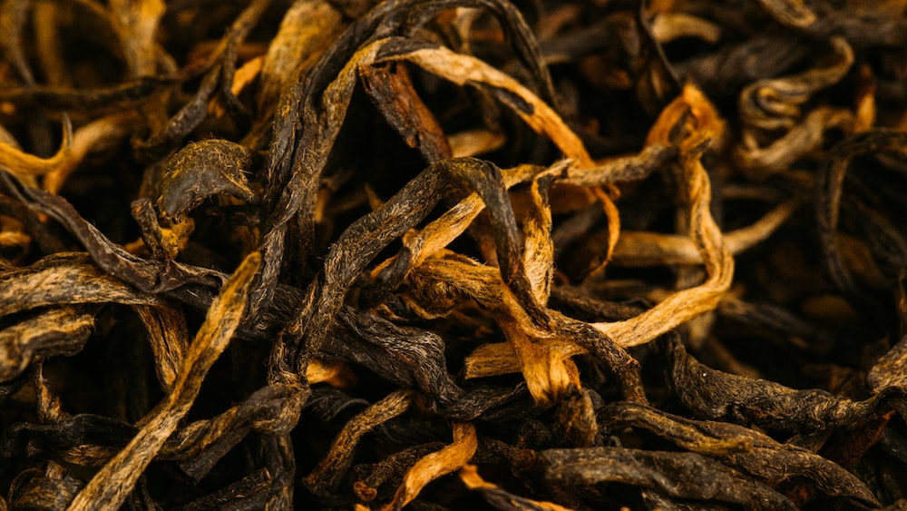 Tea Leaves on Yellow Surface