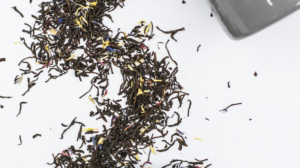 Tea Time Bliss: Savoring the Elegance of Earl Grey in a Black Ceramic Teacup