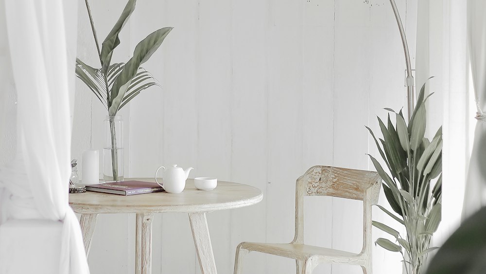 Tea Time Setting: White Corner with Steel Chair and Round Table