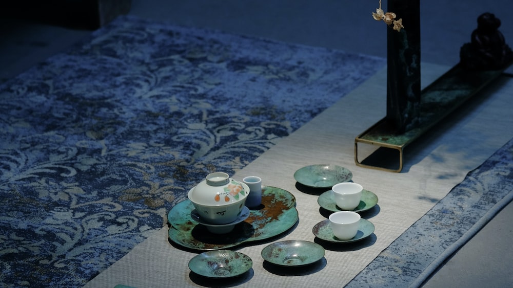 Tea in 雨过天晴: An Illustration of Teal Ceramic Plate and Saucers